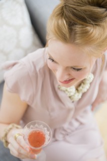 Young woman holding glass of champagne