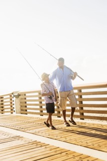 Father and son (10-11) fishing