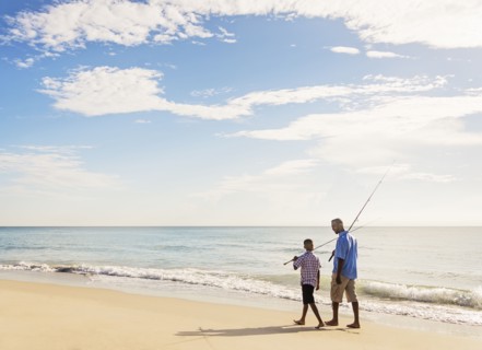 Father and son (10-11) fishing