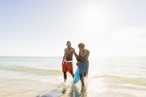 Mature couple walking in sea