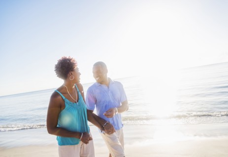 Mature couple walking on beach