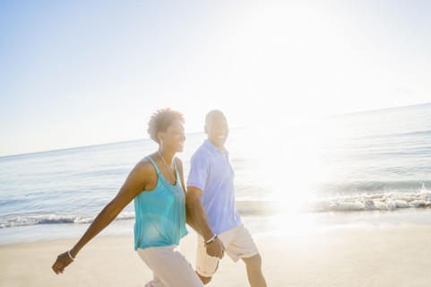 Mature couple walking on beach