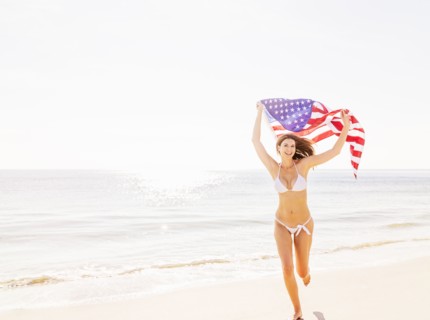 Woman holding American flag