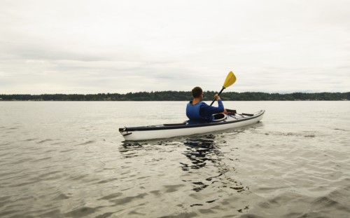 Man kayaking on lake
