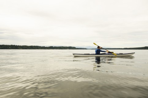 Man kayaking on lake