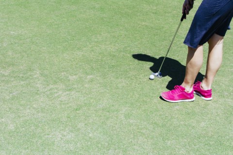 Low section of man playing golf