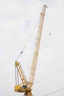 Crane against cloudy sky