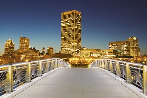 Pedestrian bridge with skyline in background