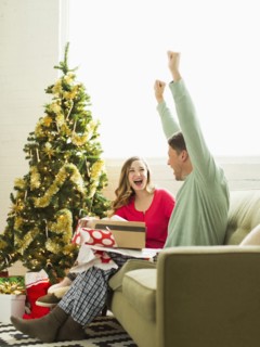 Young man surprised with Christmas gift