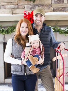 Portrait of family with one child (2-5 months) and sledge