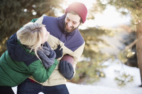 Couple playing American football