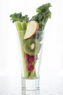 Studio shot of fruits and vegetables in glass.