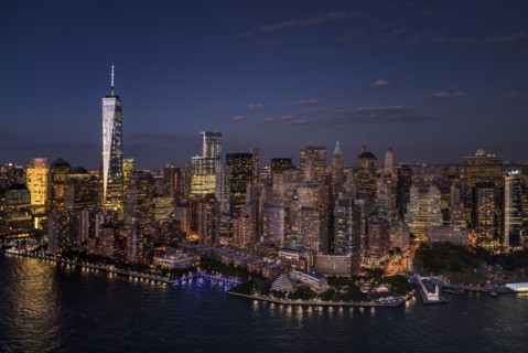 Aerial view of city with Freedom tower at night. New York City, New York.