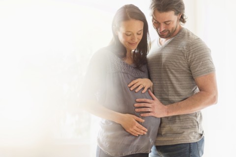 Happy man and his pregnant woman.