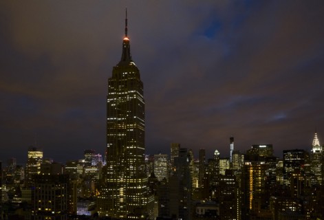 Cityscape with Empire State Building at night. New York City, New York.