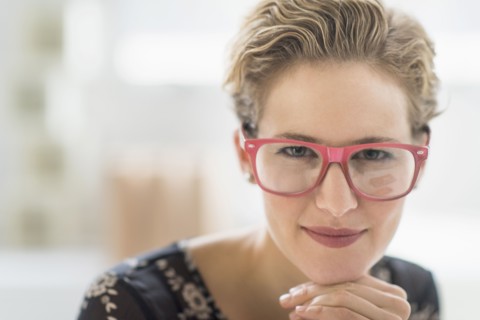Portrait of young woman wearing glasses.