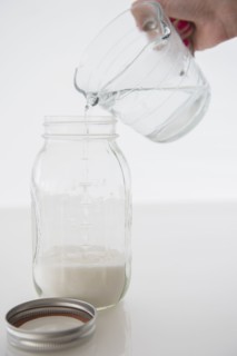 Woman mixing milk with water