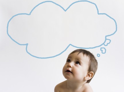 Girl (12-17 months) looking at thought bubble