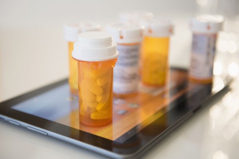 Pill containers on digital tablet