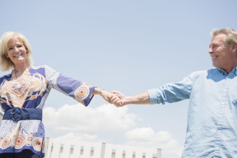 Portrait of smiling couple holding hands