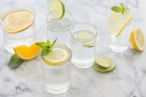 Studio shot of drinks with lemon, lime and orange