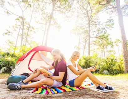 Couple sitting in front of tent