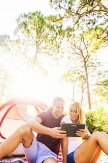 Couple looking at digital tablet