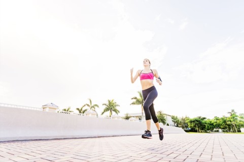 Woman running along promenade