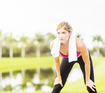 Young woman resting during work-out