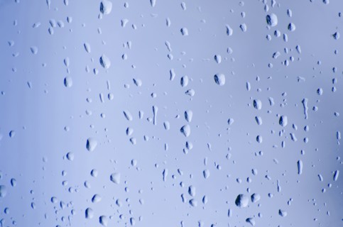 Studio shot of water drops on glass