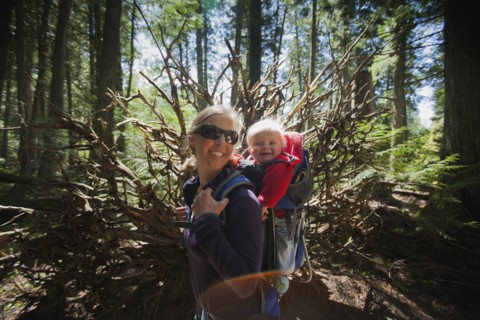 Woman with son (4-5) on trail of cedars