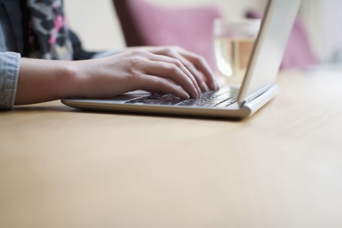 Close-up of woman using laptop