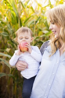Portrait of mother and daughter (12-17 months) in field