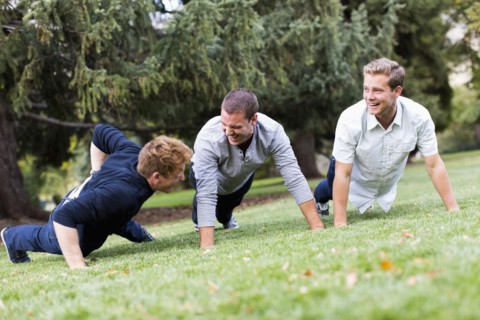 Young man doing push ups in park