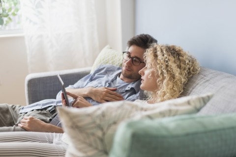 Couple using tablet pc.