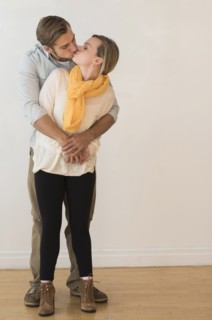 Young couple embracing and kissing.