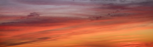Panoramic view of sunrise sky with clouds.