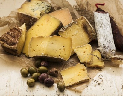 Selection of cheese on wooden table, studio shot.