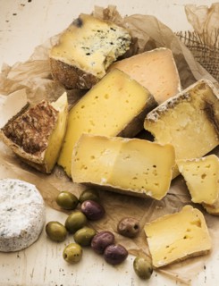 Selection of cheese on wooden table, studio shot.
