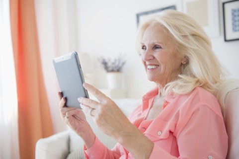 Portrait of senior woman using digital tablet