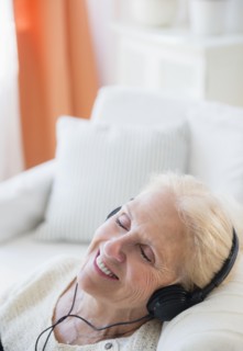 Senior woman listening to music