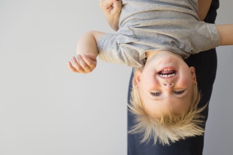 Portrait of boy (2-3) upside down