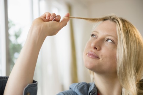 Woman twisting her hair
