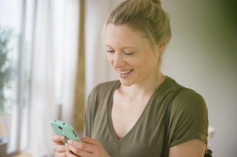 Woman texting on mobile phone