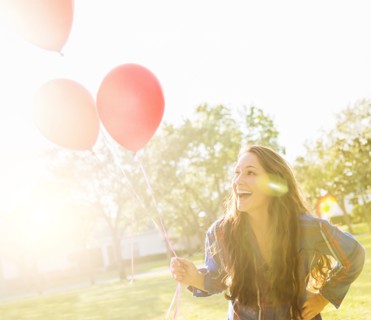 Woman with balloons outdoors