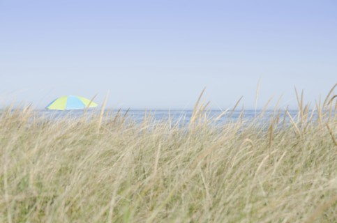 View of beach umbrella by sea