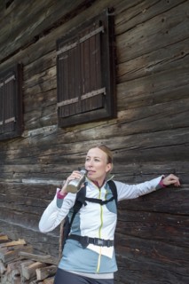 Woman hiker drinking from bottle