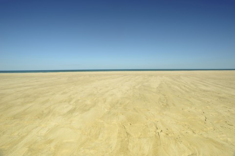 Sand plateau and horizon over water