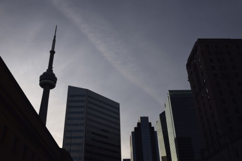 Low angle view of city architecture and communications tower