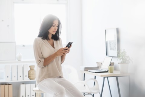 Woman using smart phone.